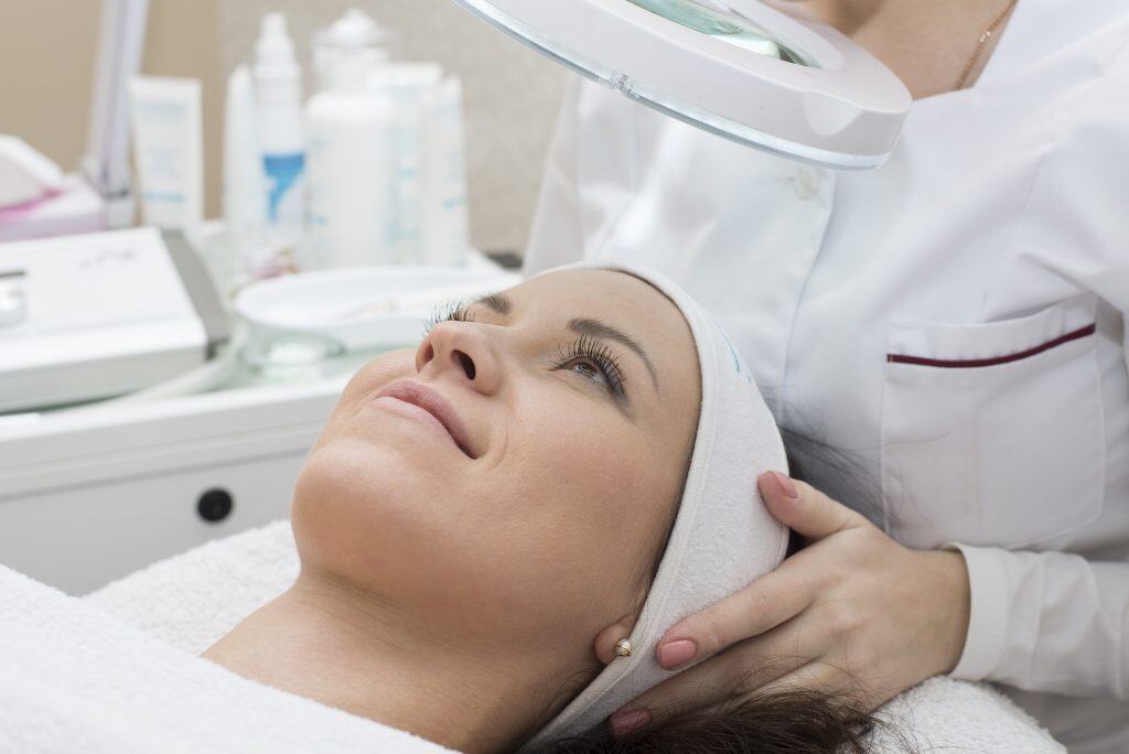 Image of Woman receiving cleansing therapy. Skin care